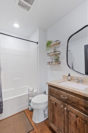 Shower, hair dryer, towels, shampoo