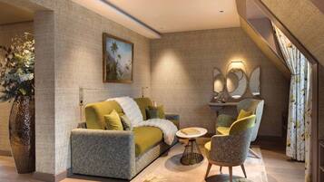 A modern living room with a sofa, armchairs, a coffee table, a painting, and a large vase.