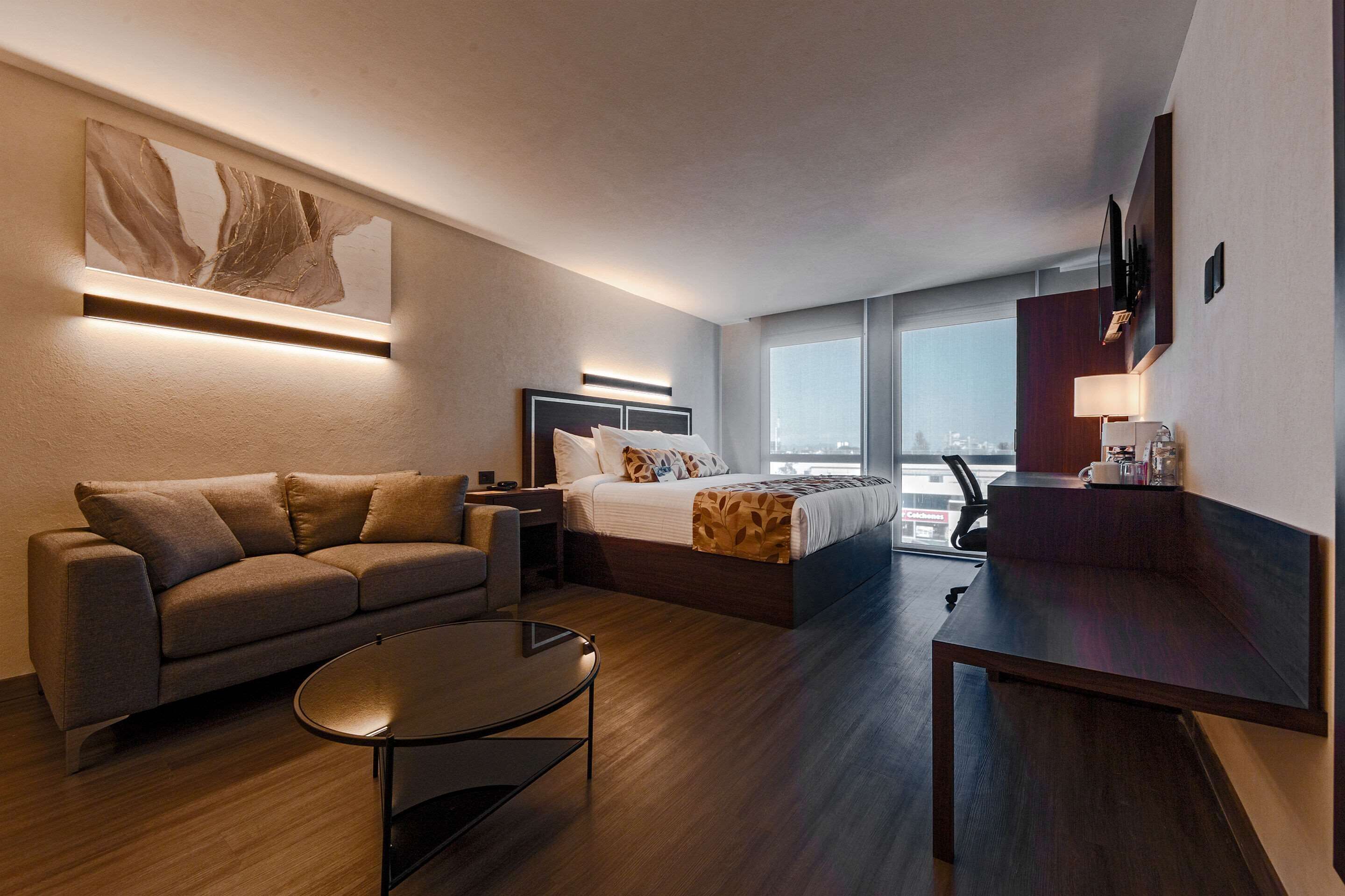 room, 1 king bed, non smoking | in-room safe, desk, laptop workspace, soundproofing