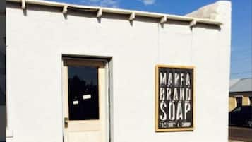 A building with a sign that reads "MARFA BRAND SOAP".