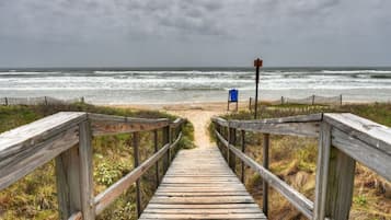 On the beach, sun-loungers, beach towels