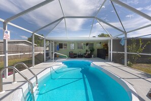 A heated pool - Your Coastal Retreat: Cozy Beach House with Heated Pool in Yacht Club Community (Cape Coral)