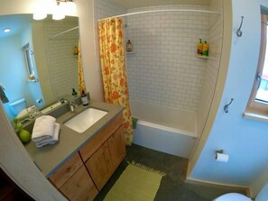 Combined shower/tub, hair dryer, towels, soap