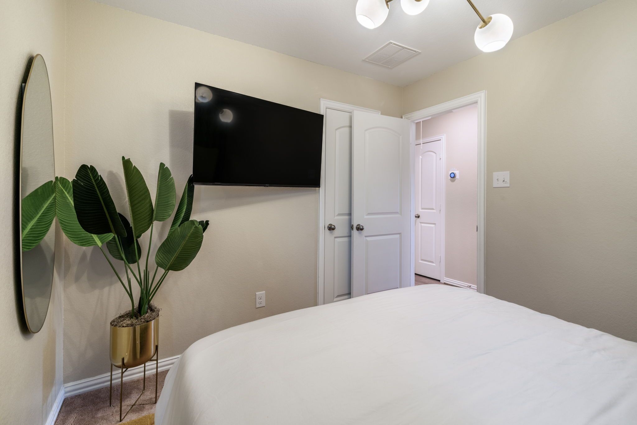 Smart tv in secondary room with Queen bed.