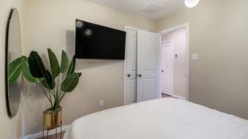 Smart tv in secondary room with Queen bed.