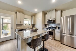 Well-equipped kitchen.  Cook a full Thanksgiving dinner with the fully stocked kitchen.  Kitchen includes dishwasher, toaster, blender, rice cooker and cooking and baking utensils,  and spices. - Spacious Retreat with King Bed & Large Backyard Mid-Century Modern Design  (Atascocita)