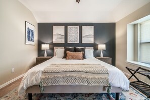 Newly renovated master bedroom with King sized bed.