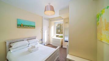 Iron/ironing board, travel crib, free WiFi, bed sheets