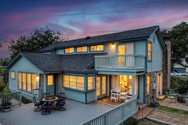 Lakeview Landing at golden hour — the multi-level deck glows at dusk, welcoming your group back from Moody Gardens or Schlitterbahn.
