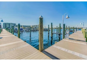 Walk along the boardwalk, taking in the views of the marina.