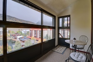 Enjoy a view of the town and water from this room's large window.
