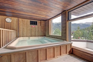 Relax in a spacious room with a bathtub and mountain views.