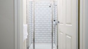 Shower, hair dryer, towels, shampoo