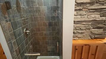 Shower, towels, soap, toilet paper