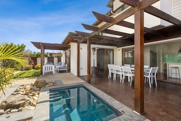 The outdoor heated spa is a highlight of the property