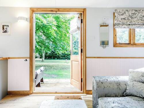 A lovely shepherd’s hut, set quietly in a paddock with shade from mature trees.