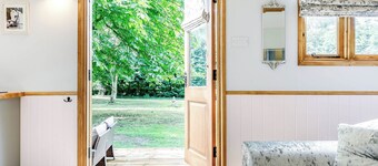 A lovely shepherd’s hut, set quietly in a paddock with shade from mature trees.