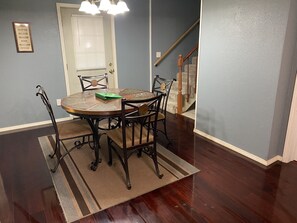Enjoy meals in this cozy dining area with a round table and four chairs.