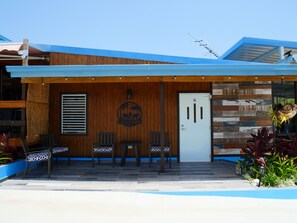 A modern building with a wooden facade, a blue awning, and a sign reading "Casa Carino." - Casa Garito La Parguera - Home for up to 24 guests (La Parguera)