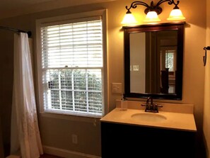 Combined shower/bathtub, hair dryer, towels, soap