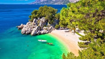 Beach nearby, white sand, beach massages, 3 beach bars