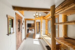 Corridors lead to spacious rooms with large windows and comfortable seating areas.