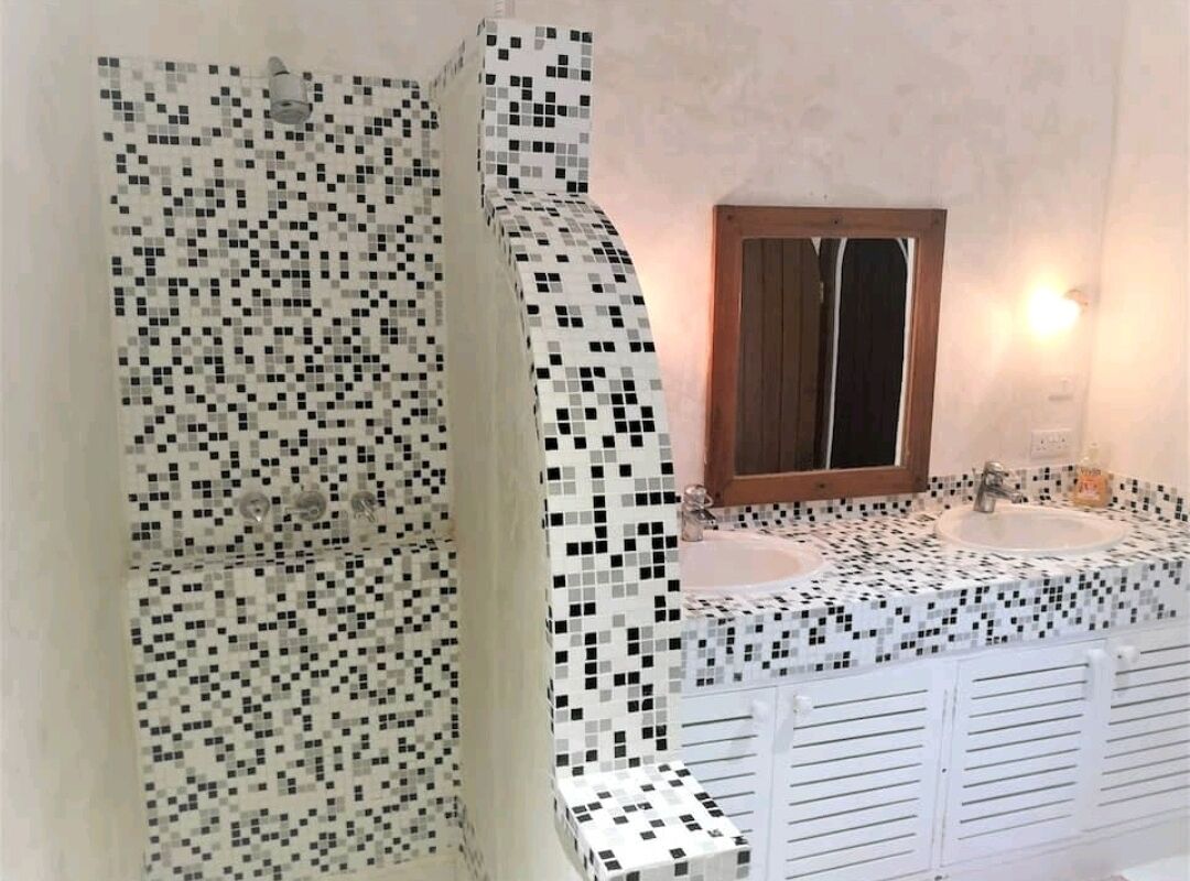 Bathtub, hair dryer, towels, soap