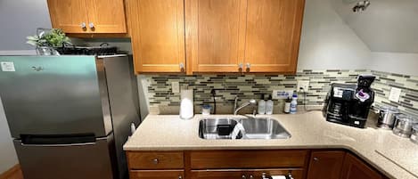 Fridge, microwave, stovetop, coffee/tea maker