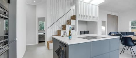 Fridge, stovetop, dishwasher, coffee/tea maker