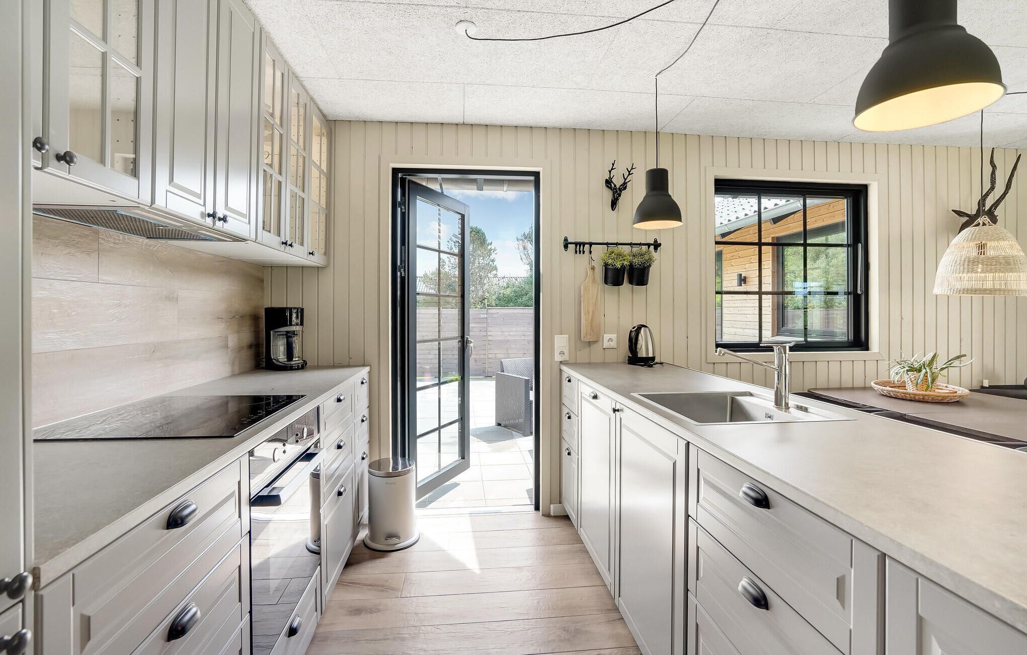 Fridge, stovetop, dishwasher, coffee/tea maker