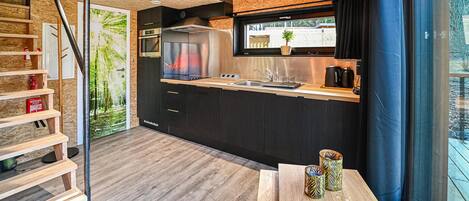 Fridge, stovetop, dishwasher, coffee/tea maker