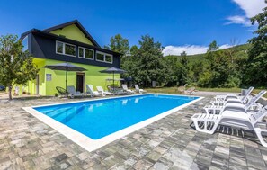 A heated pool, pool loungers