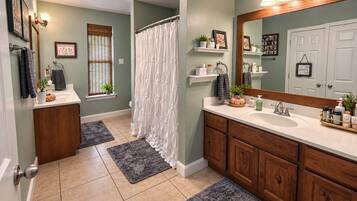 Combined shower/tub, hair dryer, towels, soap