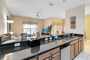 Enjoy cooking in this well-equipped kitchen with a toaster, coffee maker, and dishwasher.