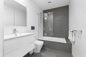 Combined shower/tub, hair dryer, towels, soap - McCrae Beach Front Villa Unit 1 (McCrae)