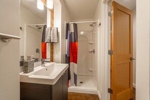 Bathtub, hair dryer, towels, soap