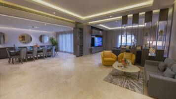 Royal Villa | Living area | 55-inch Smart TV with digital channels, TV