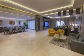 Royal Villa | Living area | 55-inch Smart TV with digital channels, TV