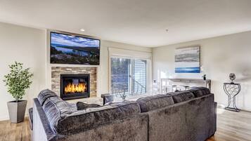 Condo, Multiple Beds, Balcony | Living room | 40-inch TV with cable channels, fireplace