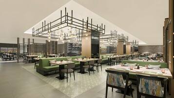 A modern restaurant with high ceilings, green seating areas, and a central bar.