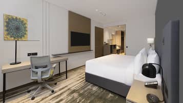 A hotel room with a bed, desk, chair, and a large artwork on the wall.