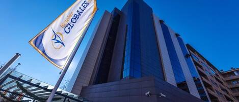 A modern hotel building with a prominent 'Hotels Globales' sign.