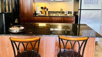 Fridge, microwave, stovetop, coffee/tea maker