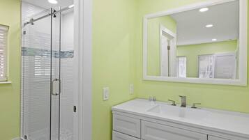 Shower, hair dryer, towels, shampoo