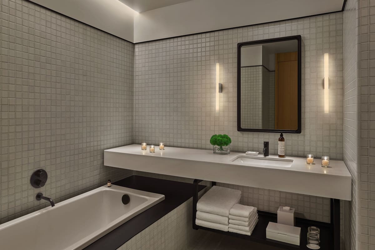 loft, 1 king bed, non smoking, courtyard view | bathroom | rainfall showerhead, eco-friendly toiletries, hair dryer, bathrobes