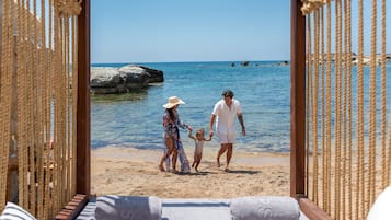On the beach, free beach cabanas, sun-loungers, beach umbrellas