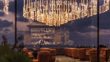 3 bars/lounges, poolside bar, beach bar
