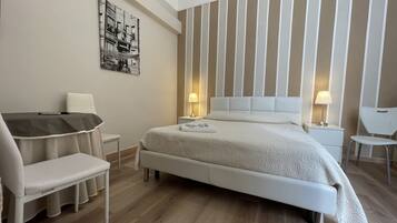 Premium bedding, pillow-top beds, desk, free WiFi