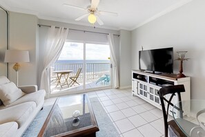 Enjoy a room with a large balcony offering a sea view, flat-screen TV, and comfortable sofa.