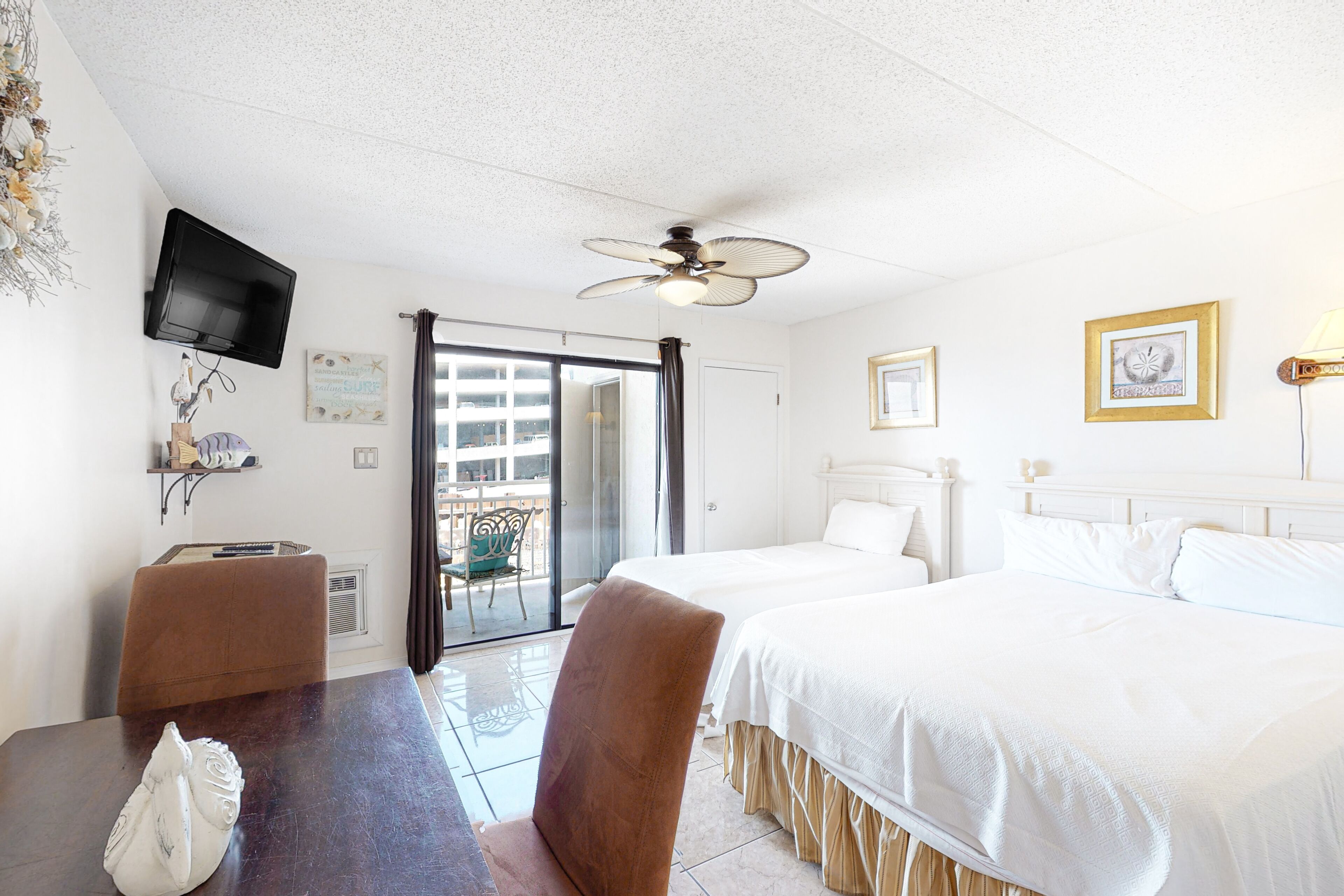 Lovely studio in beachfront resort with shared pool, central AC, & WiFi